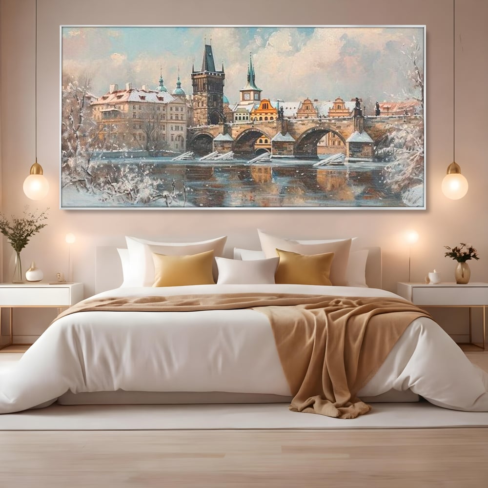 Tablou canvas cu pictura cu podul carol din praga iarna, in rama de aluminiu argintiu, pe perete intr-un dormitor